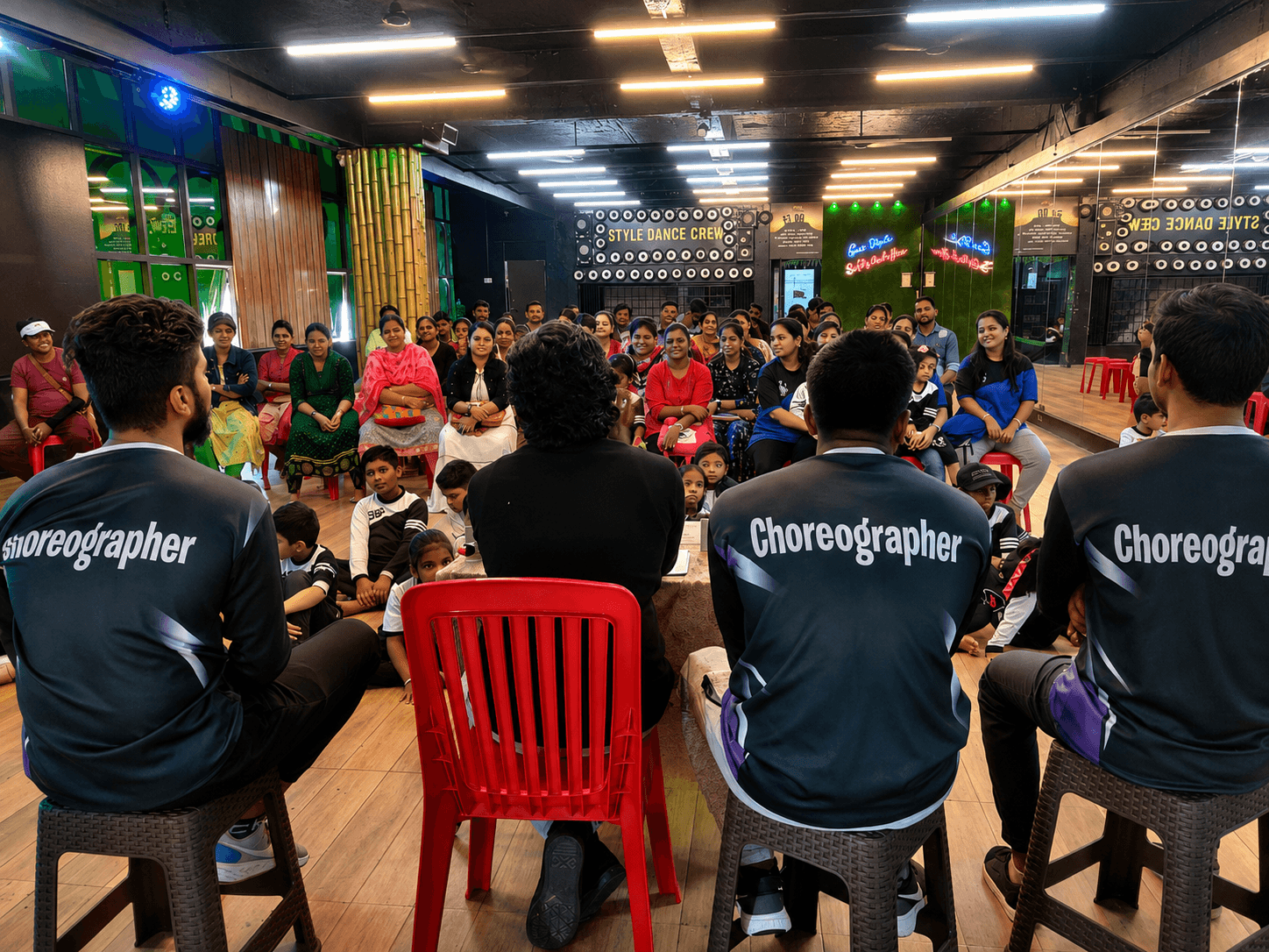Style Dance Crew Studio founder and head instructor addressing parents and students during summer camp orientation, introducing choreography instructors and program details