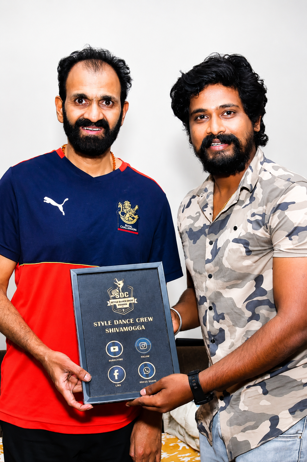 A Style Dance Crew Shivamogga memento being presented to a guest.