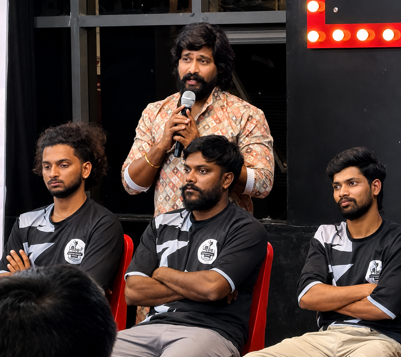 The founder addressing the Style Dance Crew team inside the studio.